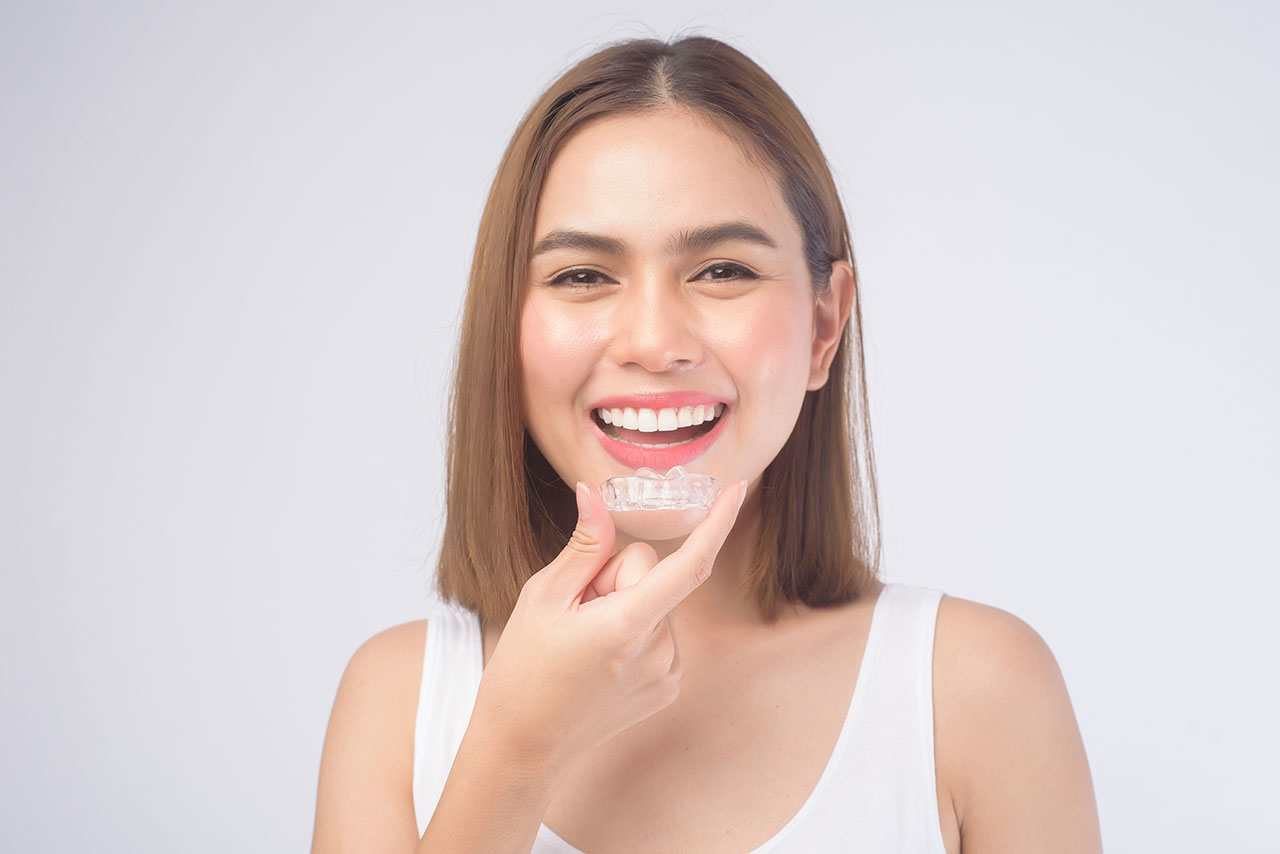 The Dental Symphony | How Clear Aligners Help Adults Achieve Straighter Smiles Without Traditional Braces